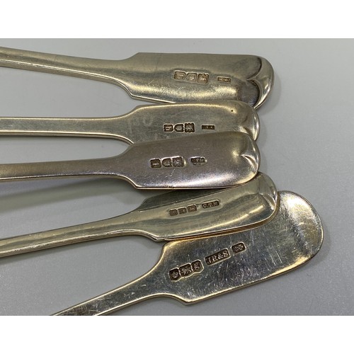 184 - Four Edwardian silver fiddle-pattern dessert spoons with bright-cut decoration, London, 1903-04, tog... 