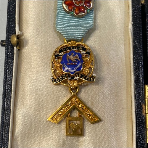 216 - A 9ct gold Masonic jewel for Paton Lodge No. 3738 and bar ‘W.M. 1973-1974’ with poppy badge on blue ... 