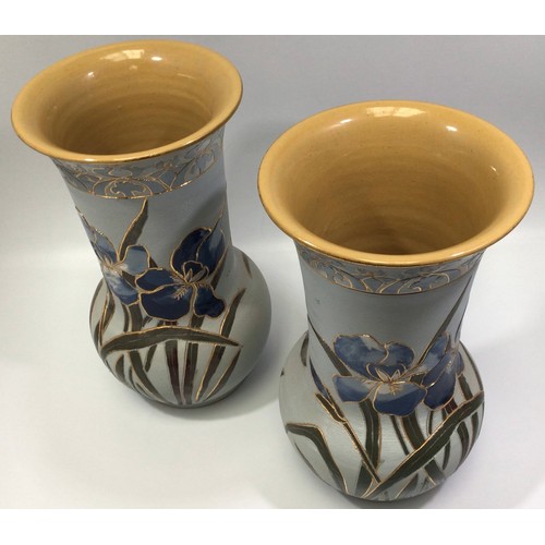 86 - A pair of Lovatt Langley Mill art pottery vases, c1914, carved, gilded and painted with Blue Iris to... 