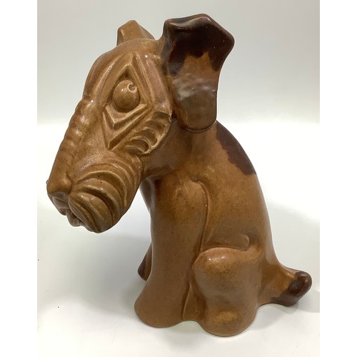 112 - A Langley Pottery brown-glazed model of seated terrier dog, c1931-39, 22cm high

Condition: Left ear... 