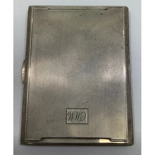 174 - A silver cigarette case by Smith & Bartlam, the outside with engine turned decoration and lozenge en... 