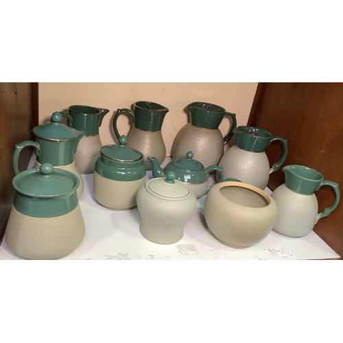 125 - Eleven Lovatt & Lovatt Pottery green 'Myrtle' domestic wares comprising jugs, jars and covers etc, (... 