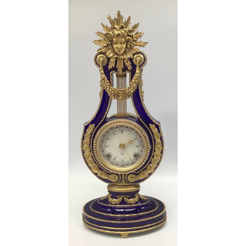 610 - A reproduction Victoria & Albert Museum Marie-Antoinette porcelain mantel clock, lyre-shaped case pa... 