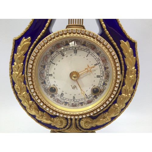 610 - A reproduction Victoria & Albert Museum Marie-Antoinette porcelain mantel clock, lyre-shaped case pa... 