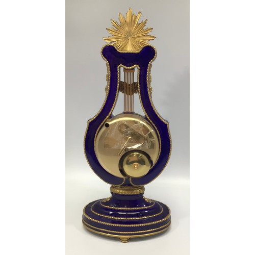 610 - A reproduction Victoria & Albert Museum Marie-Antoinette porcelain mantel clock, lyre-shaped case pa... 