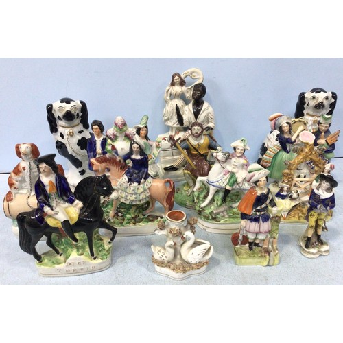 22 - A collection of thirteen various 19th and 20th century Staffordshire pottery figural groups, compris... 