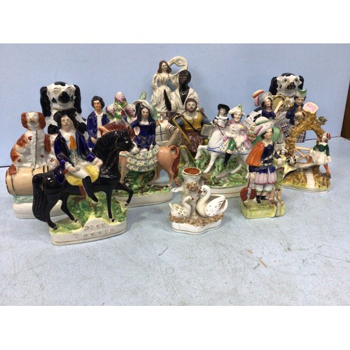 22 - A collection of thirteen various 19th and 20th century Staffordshire pottery figural groups, compris... 