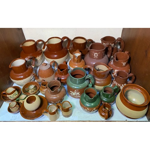 128 - A good quantity of Langley 'Brownware,' 'Bristol ware' and advertising ware jugs small bowls and mat... 