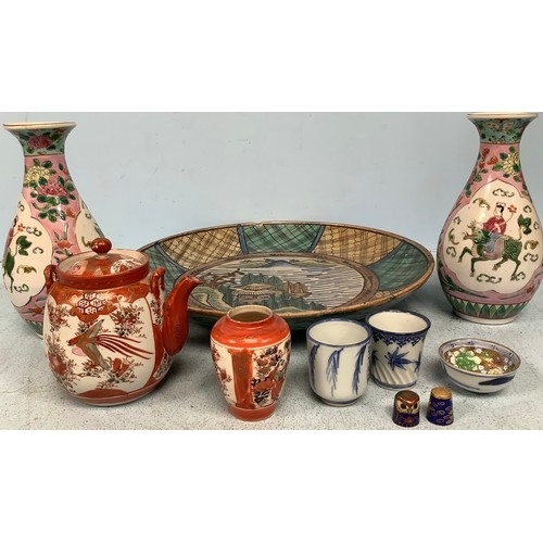 40 - A small collection of assorted Oriental ceramics including a charger, a pair of famille rose vases a... 