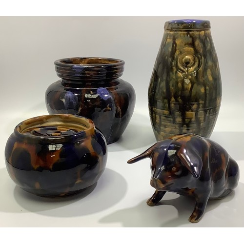 164 - A Langley Pottery piggy bank, two tobacco jars and a vase, decorated with mottled ''tortoiseshell' t... 