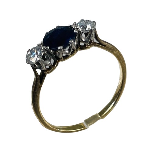 264 - An 18ct gold sapphire and diamond ring, set with a round dark blue sapphire to the centre, with a ro... 