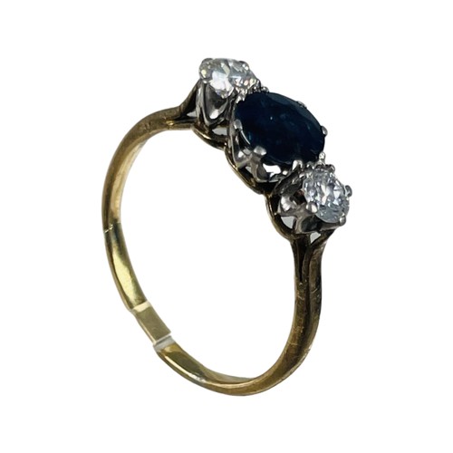 264 - An 18ct gold sapphire and diamond ring, set with a round dark blue sapphire to the centre, with a ro... 