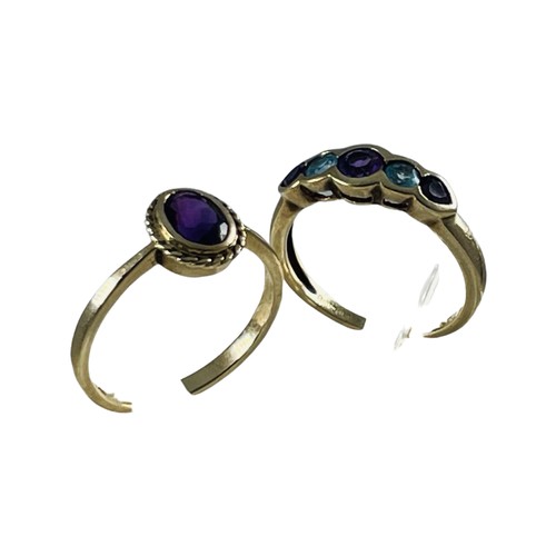 279 - A 9ct gold dress ring, set with amethysts and blue topaz, together with a 9ct gold amethyst dress ri... 