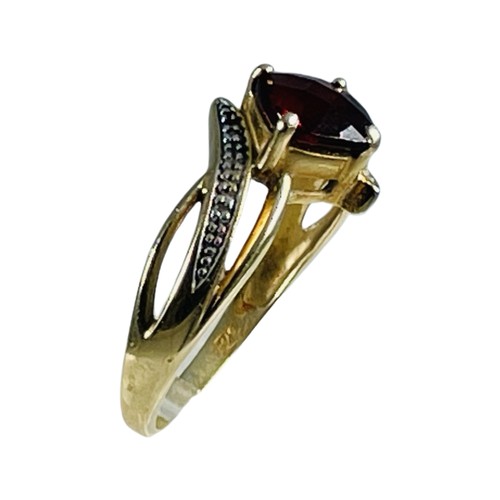 273 - A 9ct yellow gold dress ring, claw set with a square faceted garnet to the centre, ring weighs 3.2 g... 