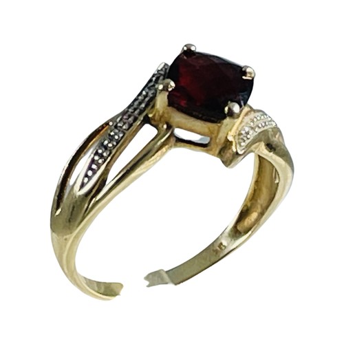 273 - A 9ct yellow gold dress ring, claw set with a square faceted garnet to the centre, ring weighs 3.2 g... 