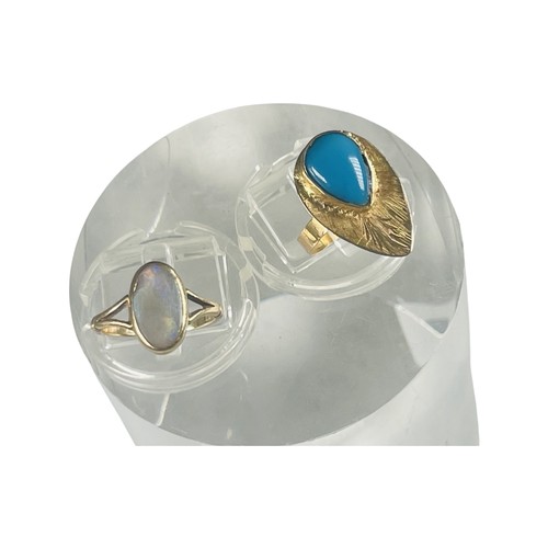 309 - An 18ct Egyptian gold ring, set with a pear-shaped cabochon blue stone, weighs 2.9 grams, finger siz... 