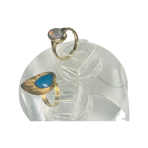 309 - An 18ct Egyptian gold ring, set with a pear-shaped cabochon blue stone, weighs 2.9 grams, finger siz... 