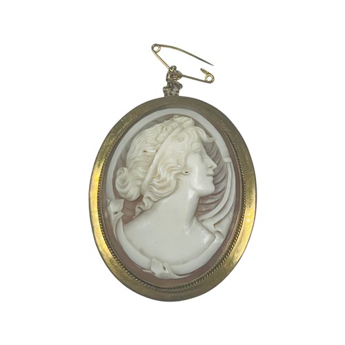 300 - A 9ct gold large oval cameo brooch, 40mm x 30mm, with safety chain, weighs 11.8 grams.