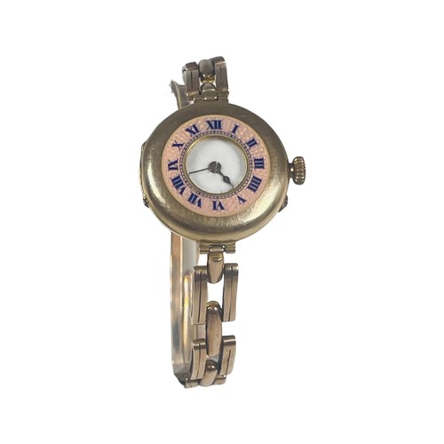 245 - A ladies 9ct gold half hunter wristwatch, on 9ct gold expandable bracelet, pink enamelled outer chap... 