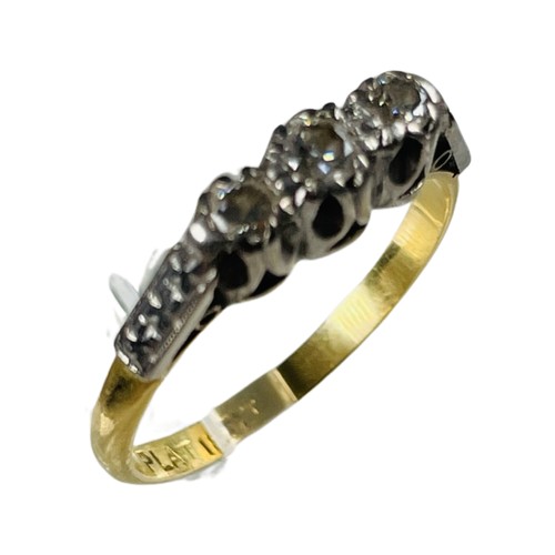 350 - An 18ct yellow gold and platinum ring, claw set with three diamonds, estimated total diamond weight ... 