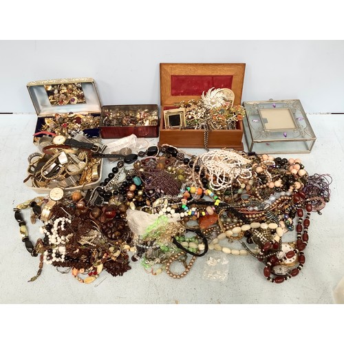 341 - A large quantity of costume jewellery and watches, including earrings, necklaces, brooches and brace... 