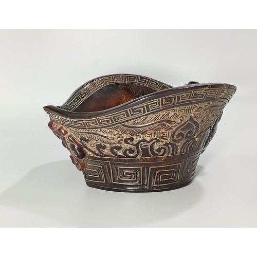 54 - A Chinese carved horn libation cup, 8cm high