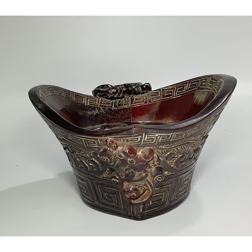 54 - A Chinese carved horn libation cup, 8cm high