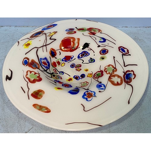 35 - A large white opaque glass charger, decorated with multicoloured flowers, 47cm diameter