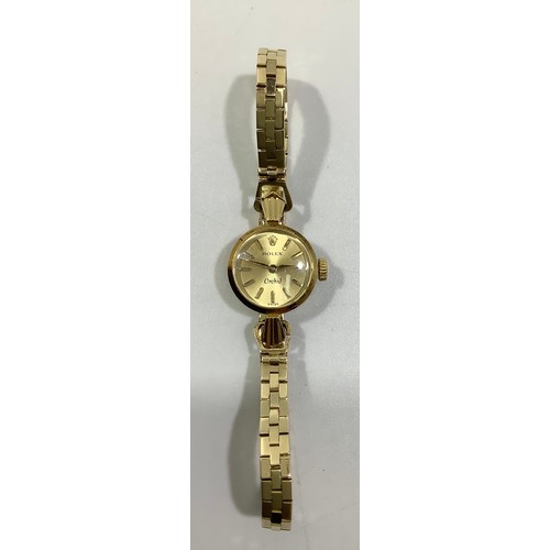 241 - A ladies 18ct gold Rolex Orchid wristwatch, the gold dial with batons denoting hours, on 18ct gold b... 