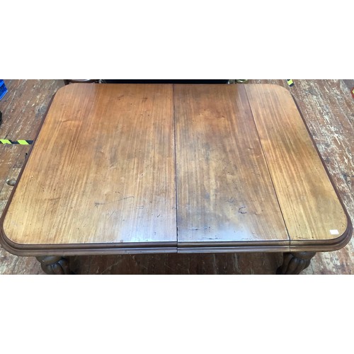 621 - A very large rectangular extending mahogany dining table with stepped rounded edges and corners rais... 