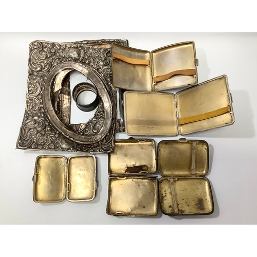 198 - A small collection of assorted silver items comprising five various cigarette cases, a napkin ring a... 