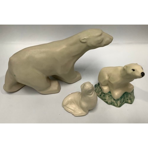 111 - Two various Langley Pottery cream-glazed polar bears, c1931-39, designed by Frederick Braddon, 18cm ... 