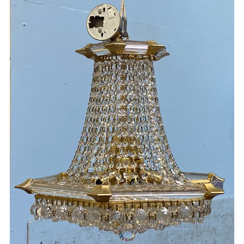 617 - A chandelier of hexagonal baluster form with cut glass droplets suspended from plastic supports, app... 