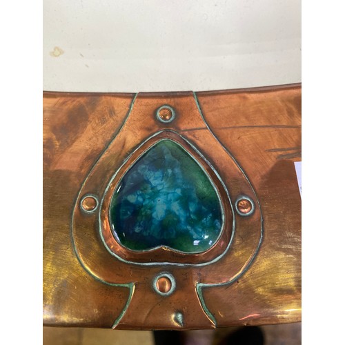 615 - A Liberty & Co Arts & Crafts oval mirror with hammered copper frame, inset with heart shaped pottery... 