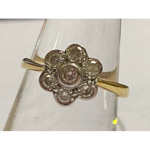 262 - An 18ct yellow gold cluster ring, with seven round brilliant cut diamonds set in a daisy design, est... 