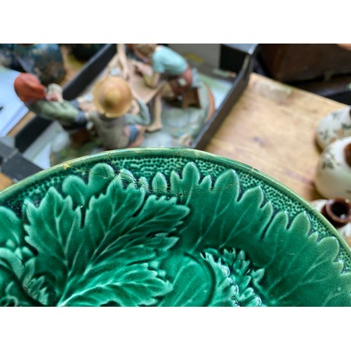 8 - Fourteen 19th century green majolica leaf-moulded plates etc (Section 53)

There is wear and crazing... 