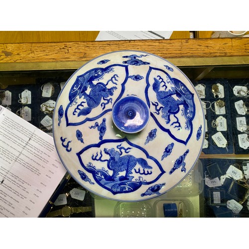 53 - A large Chinese porcelain cylindrical pot and cover painted in cobalt blue with dragns, Kangxi marks... 