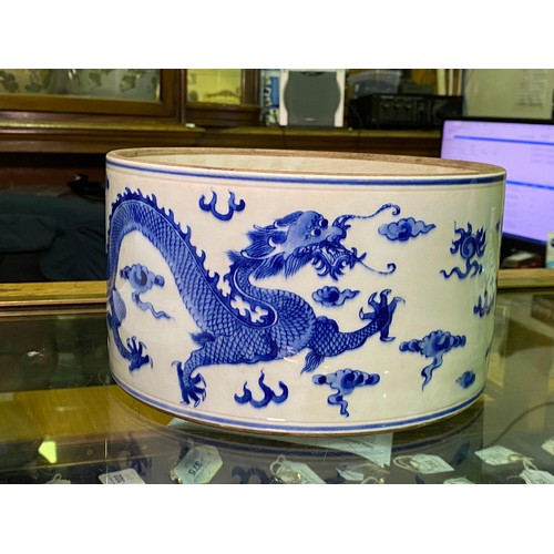 53 - A large Chinese porcelain cylindrical pot and cover painted in cobalt blue with dragns, Kangxi marks... 