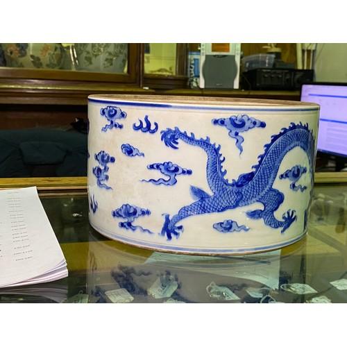 53 - A large Chinese porcelain cylindrical pot and cover painted in cobalt blue with dragns, Kangxi marks... 