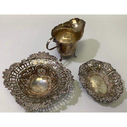 121 - A small collection of assorted silver items comprising two small dishes, one by William Hutton & Son... 