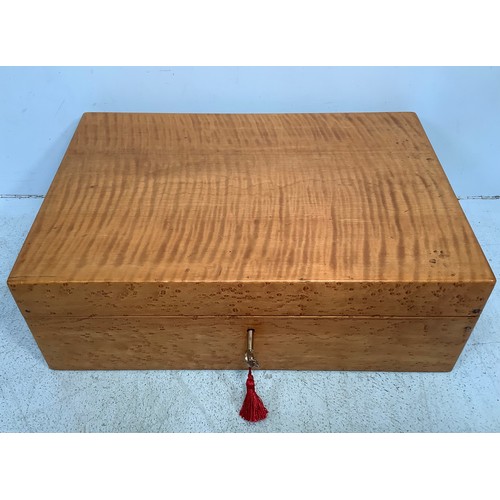 397 - A Victorian birds eye maple writing slope, opening to reveal a red velvet writing scribe and compart... 