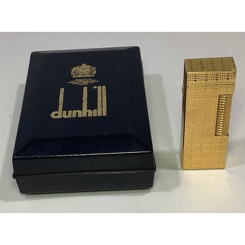 393 - A gold plated Dunhill Rollagas lighter with continuous engine turned decoration, in original box wit... 