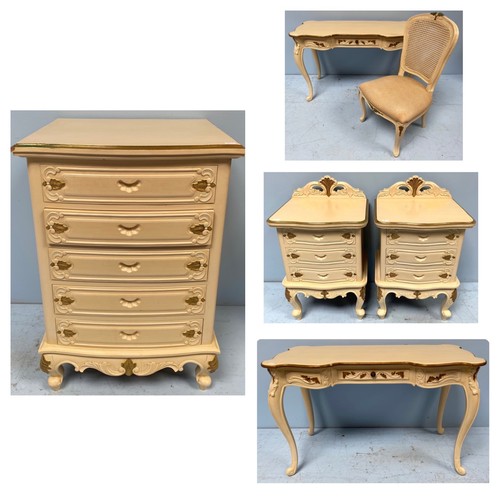 606 - A modern cream and gold painted French style chest of five short drawers, a dressing table with cane... 