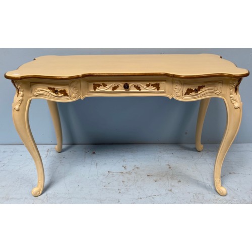 606 - A modern cream and gold painted French style chest of five short drawers, a dressing table with cane... 