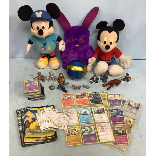 491 - A quantity of modern Pokemon cards, predominantly Sword & Shield, together with two Disney talking M... 