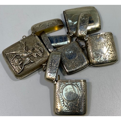 135 - Five various silver vesta cases including an example with applied figure of a lady holding a crop  o... 