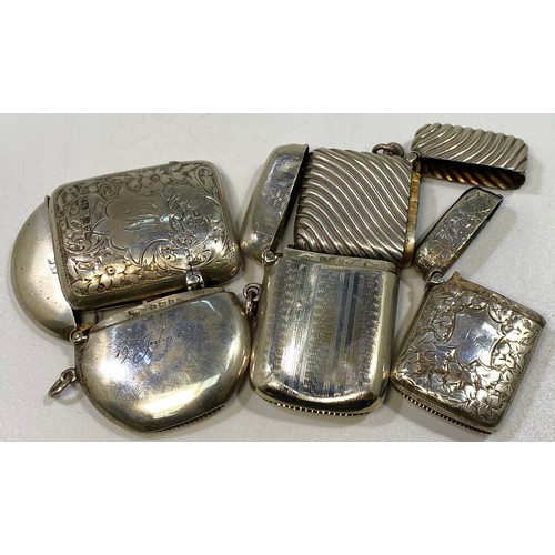 140 - Five various silver vesta cases including an example with floral and foliate decoration and engraved... 