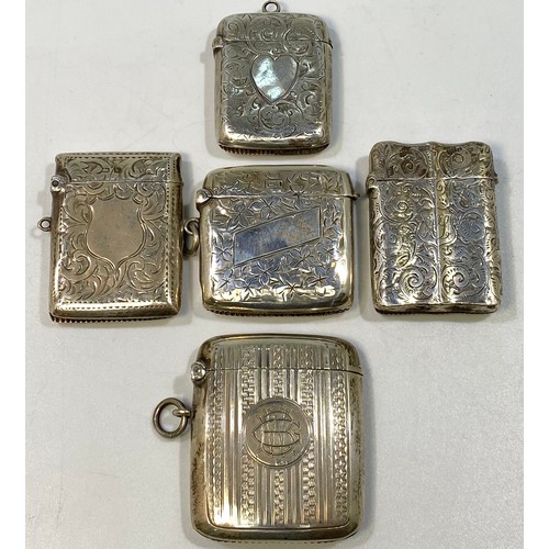 141 - Five various silver vesta cases including a Victorian example with foliate engraving and vacant hear... 