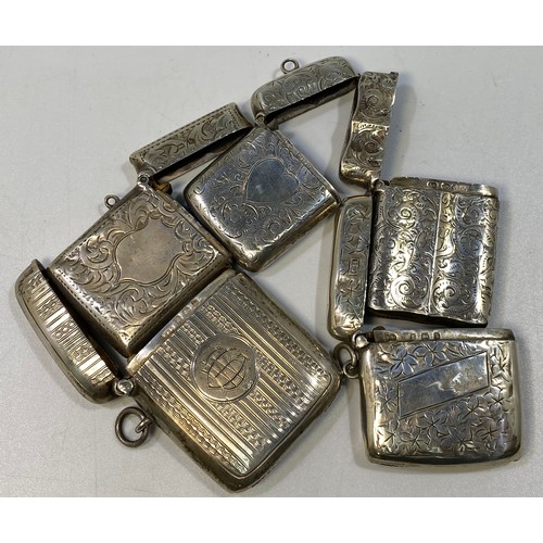 141 - Five various silver vesta cases including a Victorian example with foliate engraving and vacant hear... 