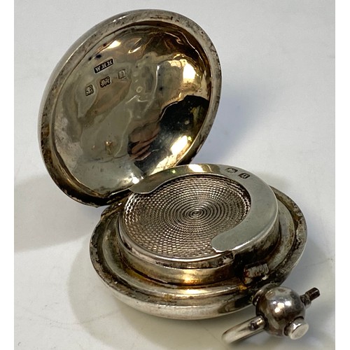 143 - A circular silver sovereign case with one side engraved with an ‘H’, Birmingham, 1912, makers Willia... 